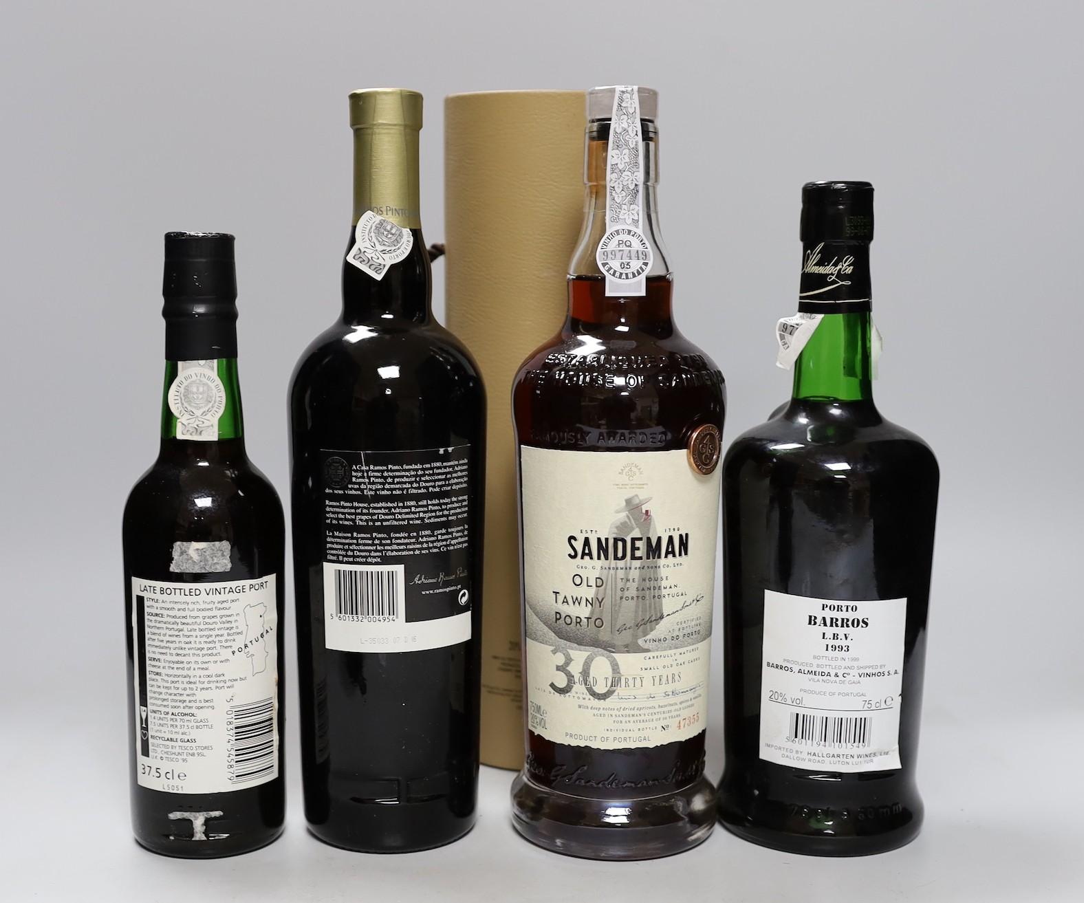 Four bottles of port: Sandeman, Barros, LBV and Ramos Pinto